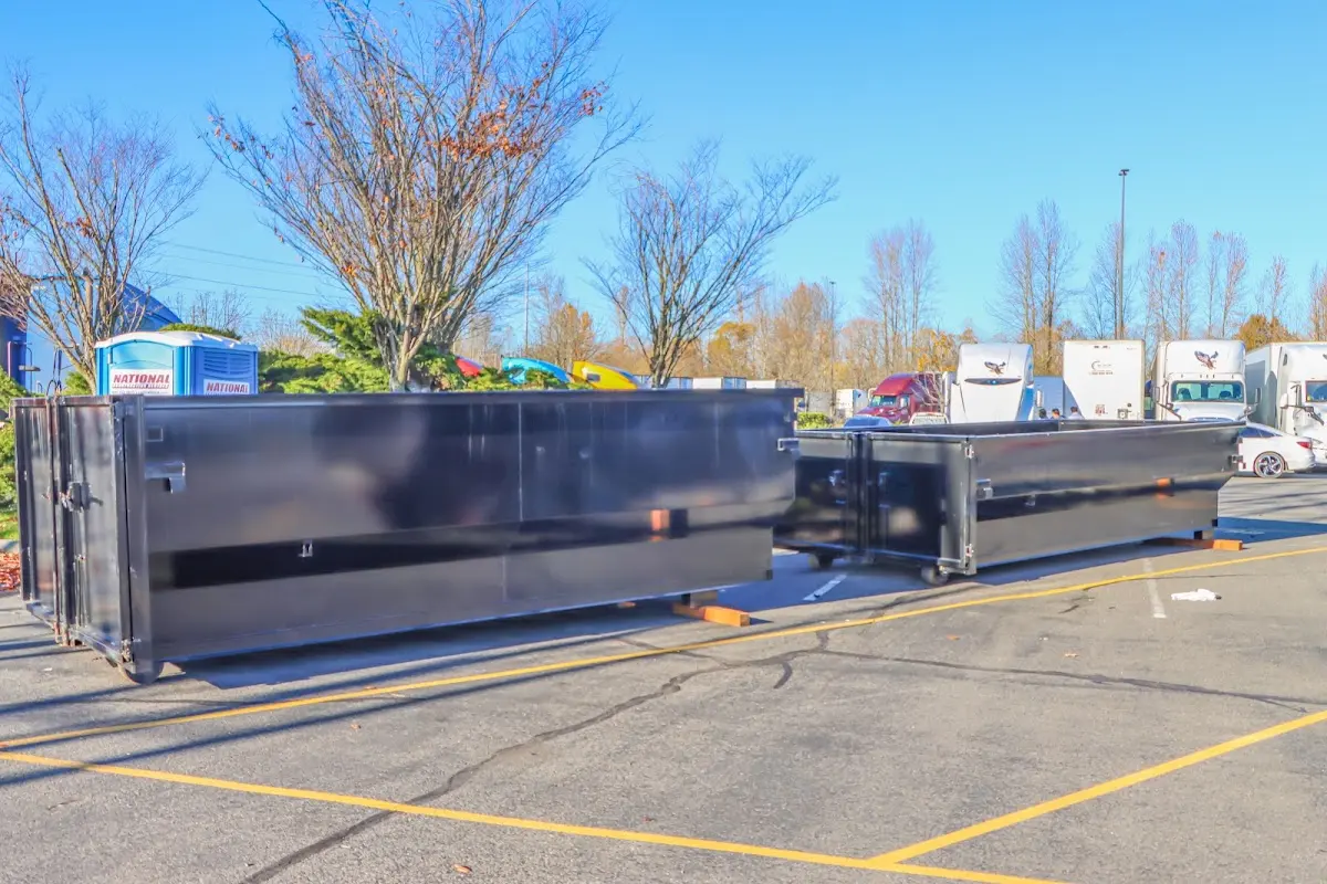 Professional dumpster rental service with roll-off container on residential driveway in Fruitland Park